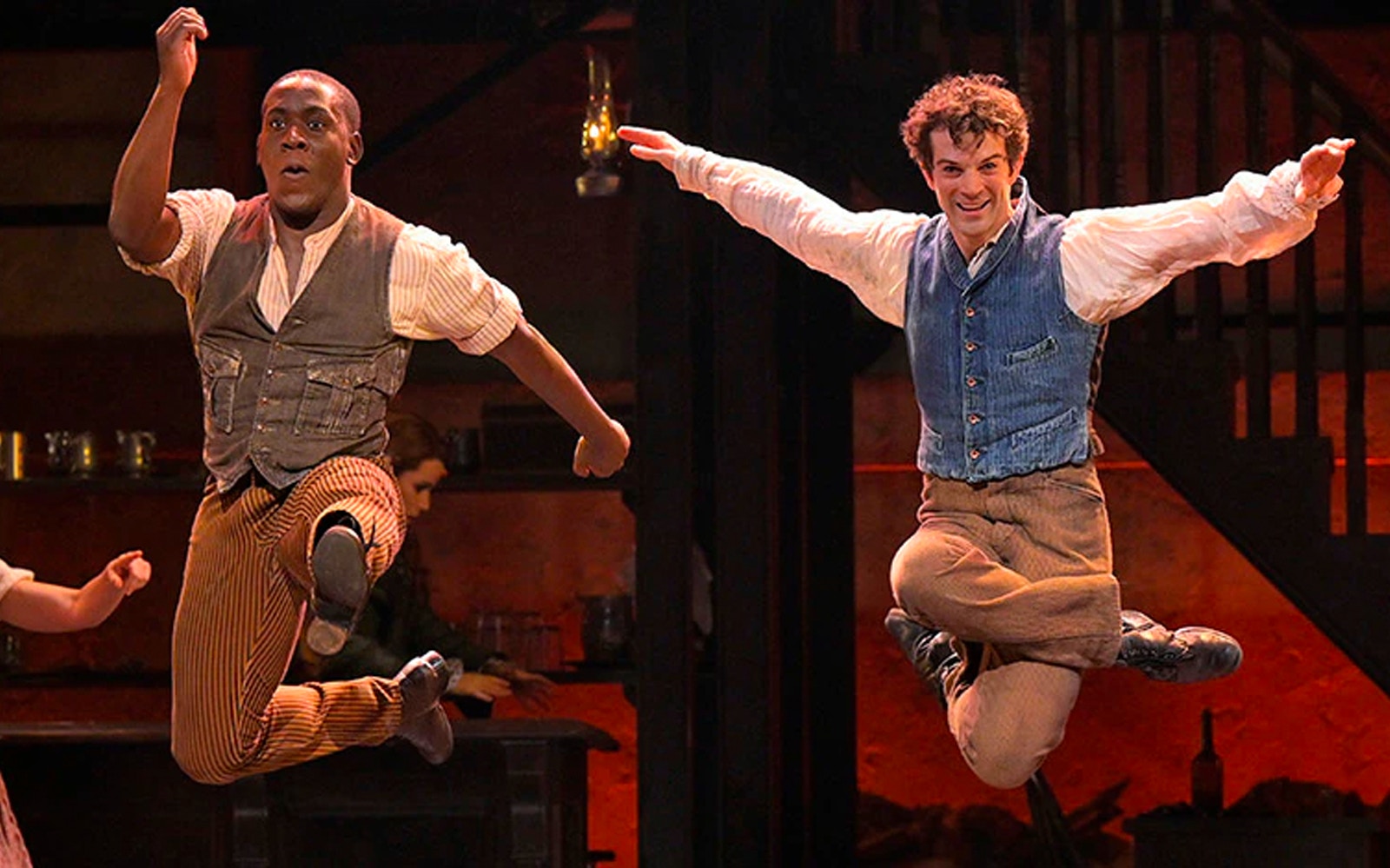 Performers dancing energetically in a scene from Paradise Square.