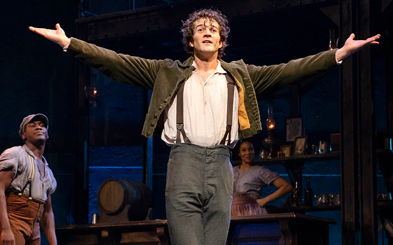 Performer on stage during Paradise Square musical scene.