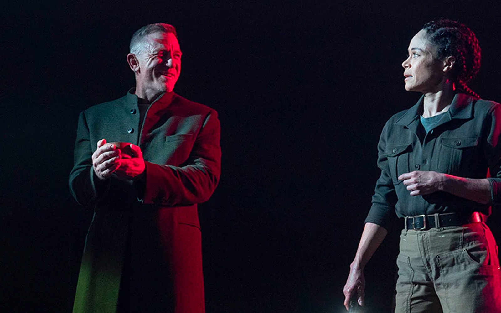 Actors performing a scene from Macbeth on stage.