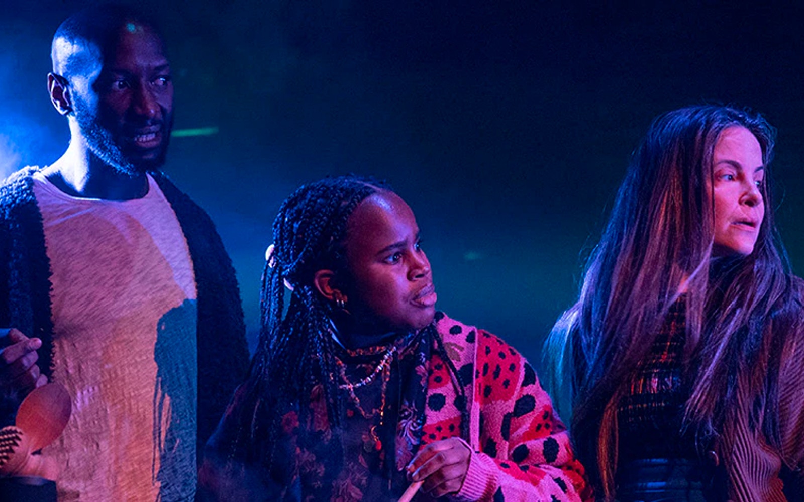 Actors performing a scene from Macbeth on stage.