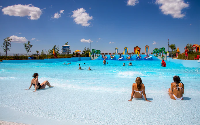 Visitors enjoying the wave pool at Mirabeach water park.