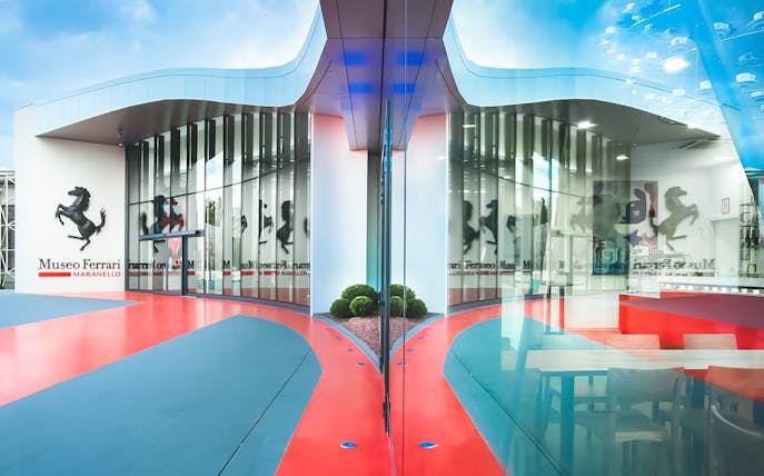 Ferrari Museum Maranello entrance with red and blue pathway.
