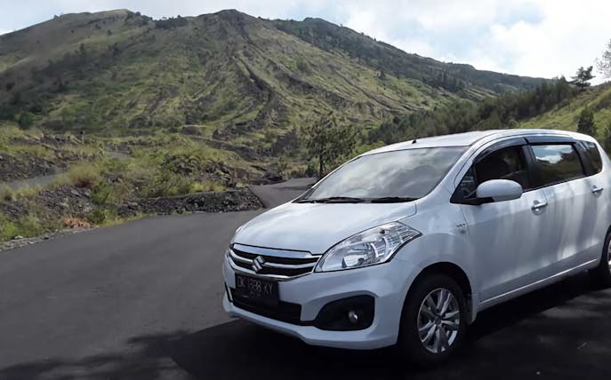 Private car with driver on a scenic road in Bali, Indonesia.