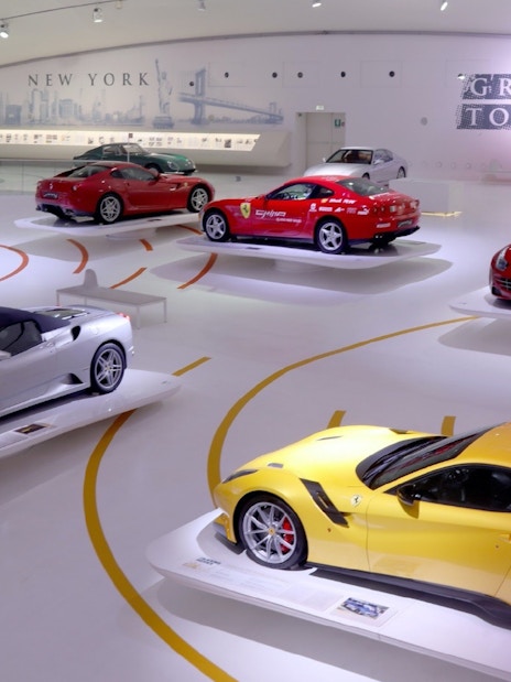 Ferrari cars on display at Museo Enzo Ferrari Modena exhibition hall.