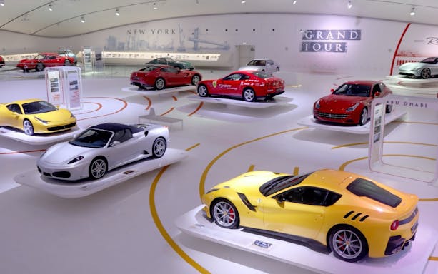Ferrari cars on display at Museo Enzo Ferrari Modena exhibition hall.