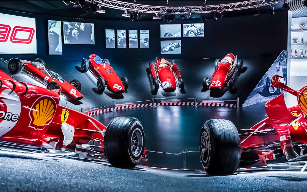 Ferrari race cars displayed at Maranello Ferrari Museum, part of the Modena Enzo Ferrari Museum combo ticket.
