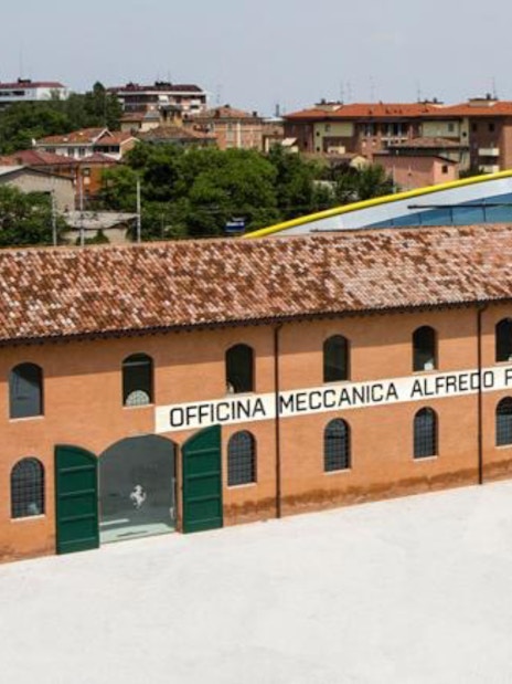 Maranello Ferrari Museum building exterior with "Officina Meccanica Alfredo Ferrari" sign.
