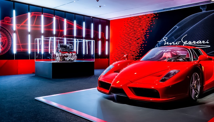 Ferrari Enzo display at Maranello Ferrari Museum with engine exhibit.