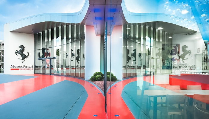 Maranello Ferrari Museum entrance with iconic prancing horse logo.