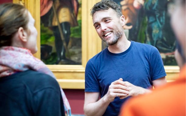 Guide explaining artwork during National Gallery tour.