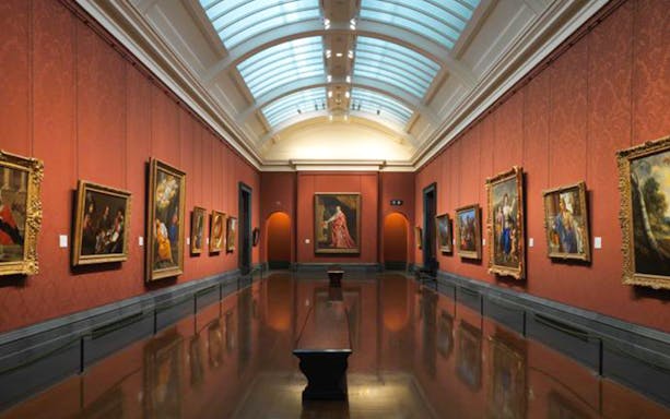 National Gallery interior with classic paintings on red walls, highlighting the art tour experience.