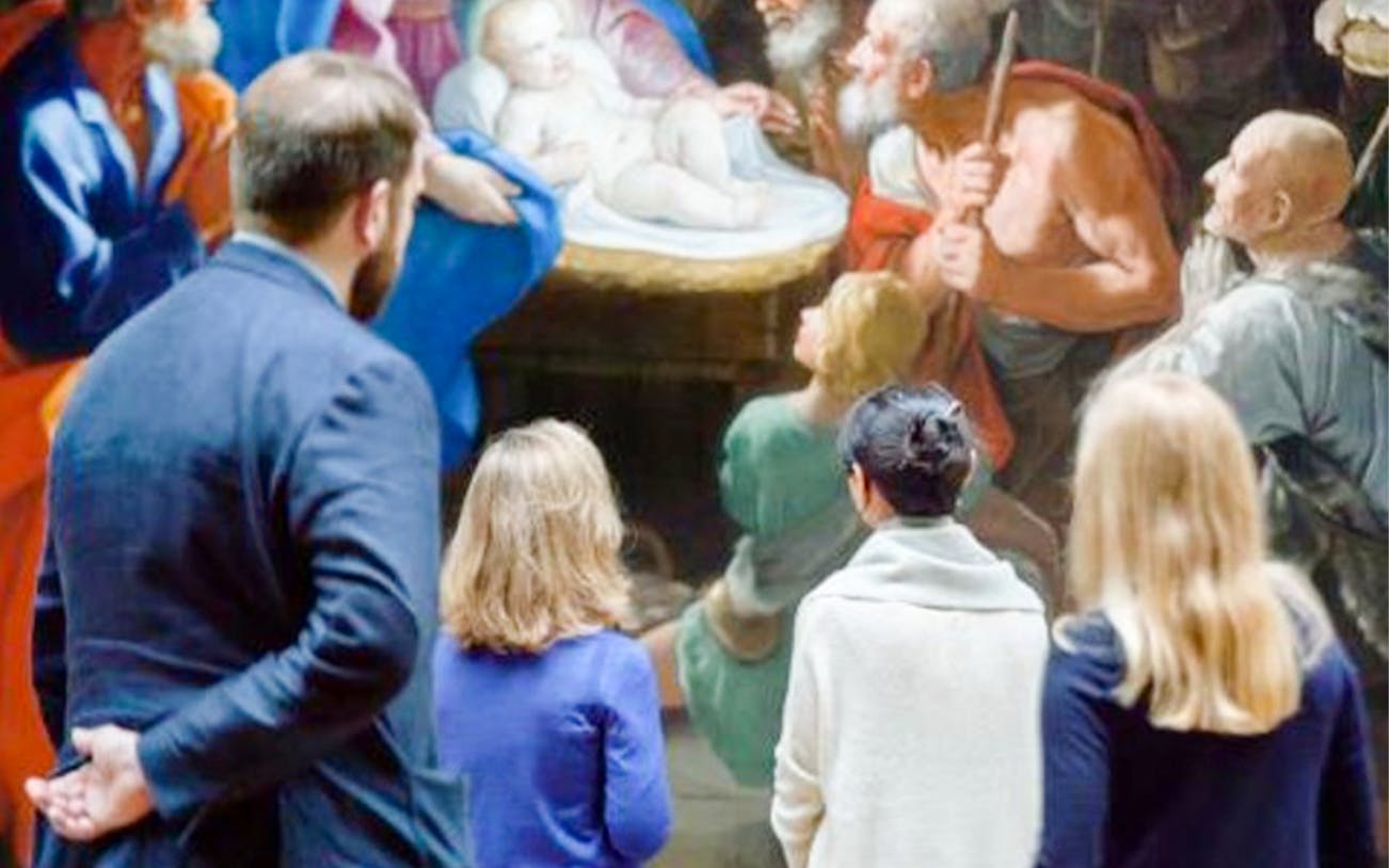 Visitors viewing a painting at the National Gallery during the Highlights Tour.