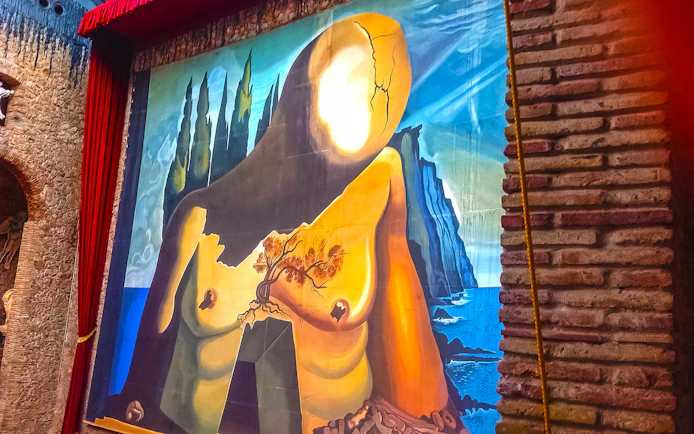 Surrealist painting at Dalí Theatre-Museum in Figueres, featuring abstract human form.