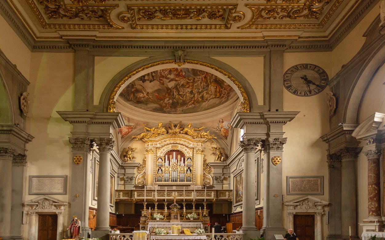 San Marco Museum interior with ornate altar and frescoed ceiling, Florence.