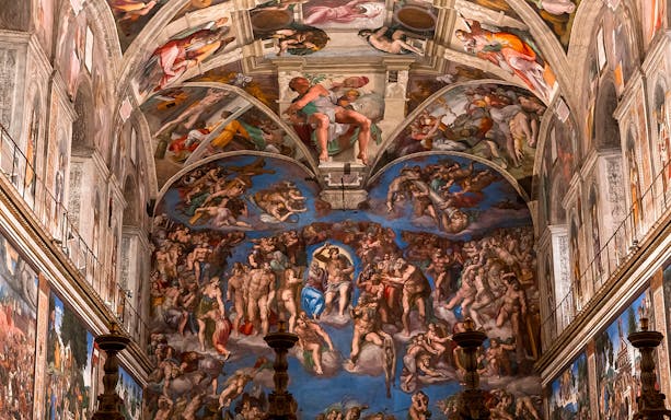Sistine Chapel ceiling frescoes in Vatican City during a guided tour.