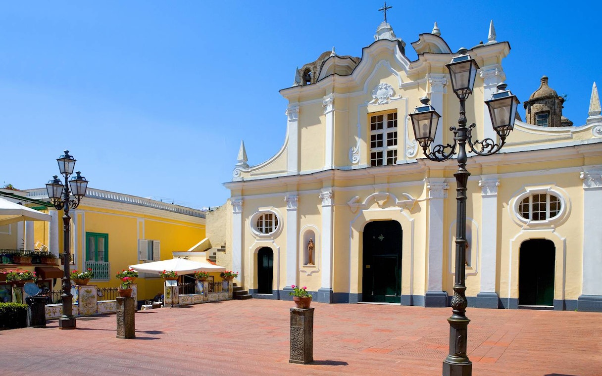 Historic church facade in Capri town square, Italy, part of Capri Island guided tour.