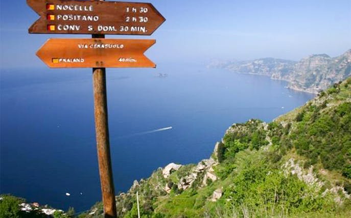 Trail sign on Path of the Gods overlooking Amalfi Coast, Italy.