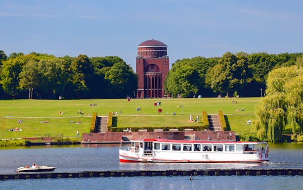 Boat on Alster Lake with Hamburg Planetarium in background, Germany.