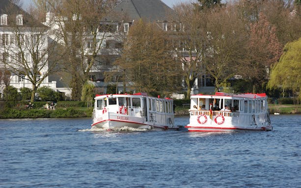 Boats on Alster Lake in Hamburg during a round trip tour.