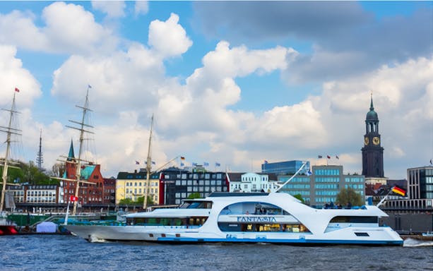 Tour boat on the Elbe River with Hamburg skyline, part of XXL Tour Blankenese.