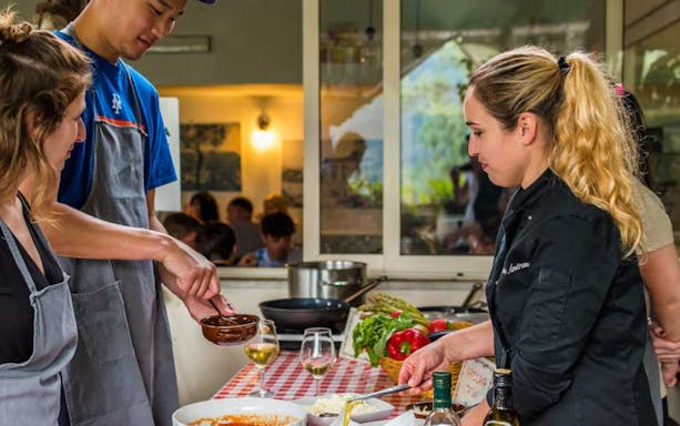 Participants cooking at a Neapolitan cooking school in Sorrento, Italy.