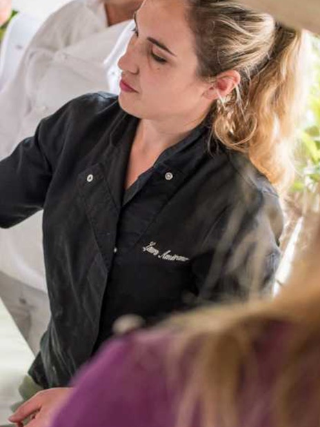 Chef preparing lemon dish at Neapolitan cooking school in Sorrento.