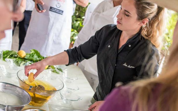 Chef preparing lemon dish at Neapolitan cooking school in Sorrento.