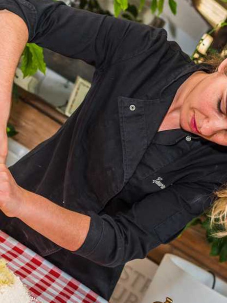 Woman preparing dough at Neapolitan cooking school in Sorrento.