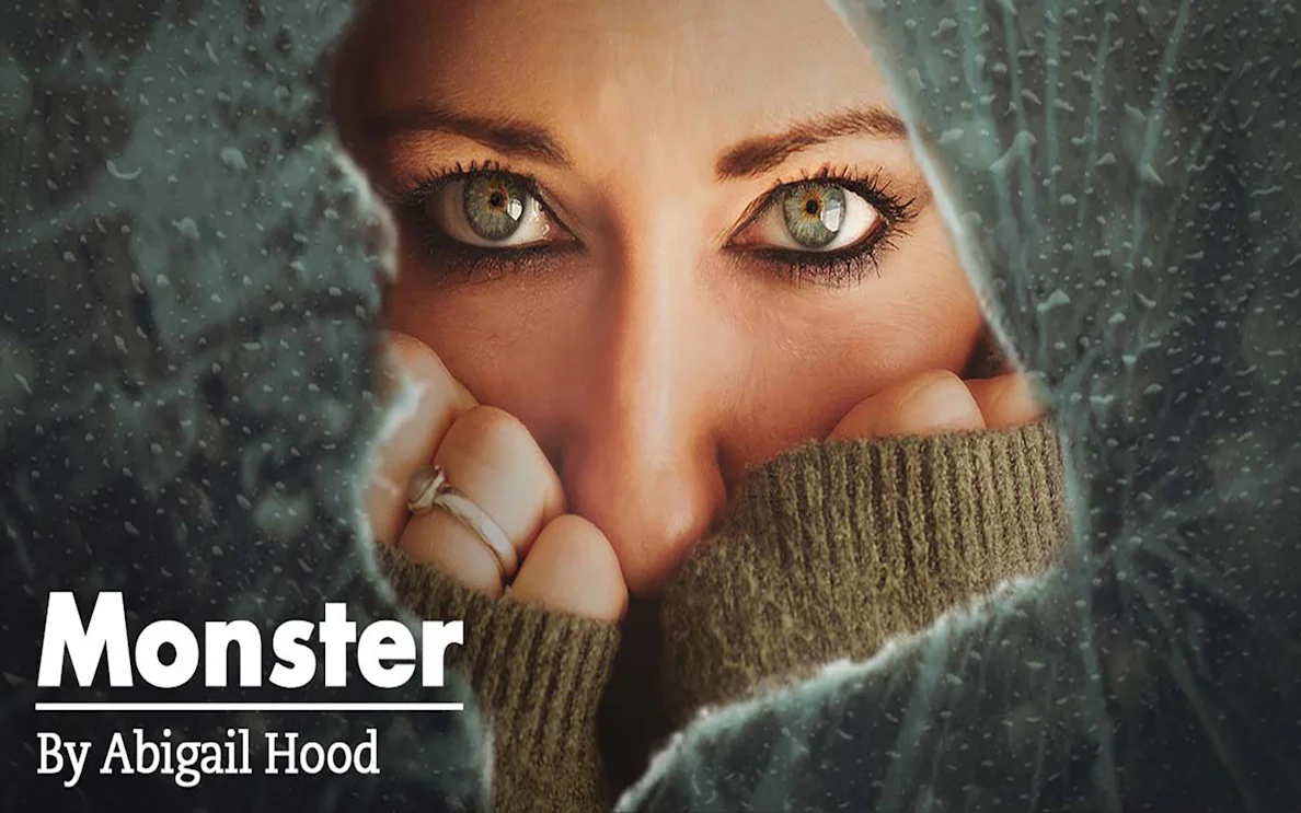 Close-up of a person's eyes peering through a cracked surface, related to "Monster.