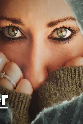 Close-up of a person's eyes peering through a cracked surface, related to "Monster.