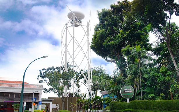 SkyHelix Sentosa tower surrounded by lush greenery at Imbiah Lookout, Singapore.