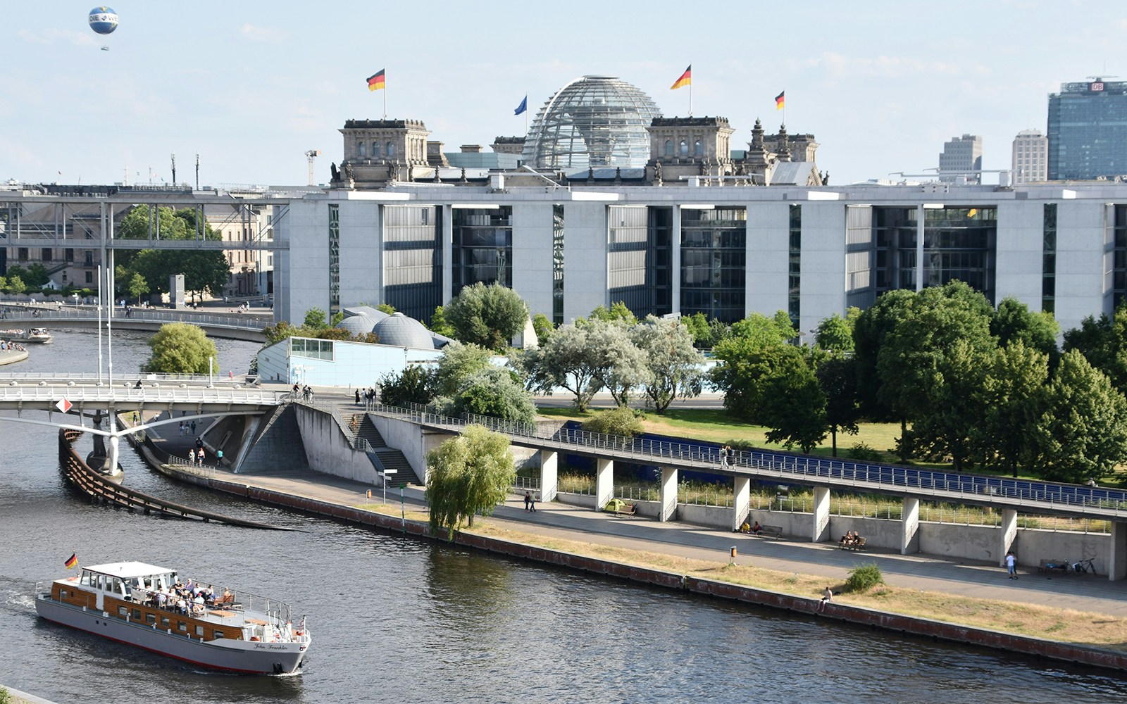 Tourists enjoying a romantic moonlit cruise on the Spree River in Berlin, Germany