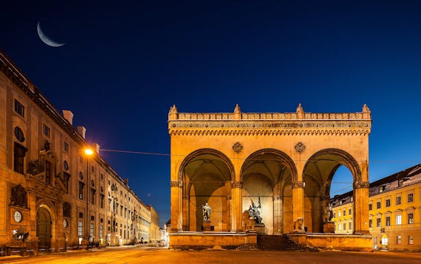 Munich's Feldherrnhalle at night, part of the City Walk and English Garden Tour.