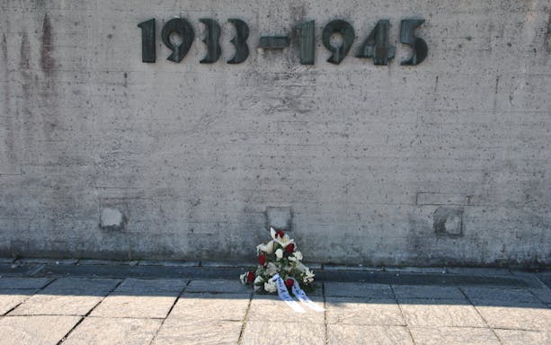 Visitors exploring Dachau Memorial, former concentration camp, Munich, Germany.