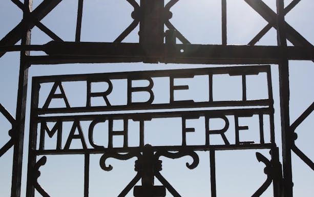 Visitors exploring Dachau Memorial, former concentration camp, Munich.