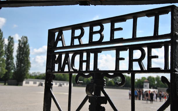 Entrance gate with "Arbeit Macht Frei" at Dachau Memorial, Germany.