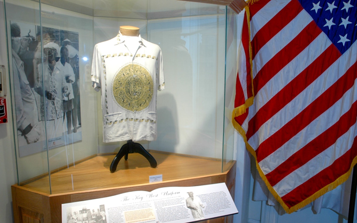 Truman's shirt display at Key West's Truman Little White House with American flag.