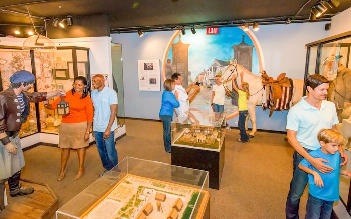 Visitors exploring exhibits at St. Augustine History Museum.
