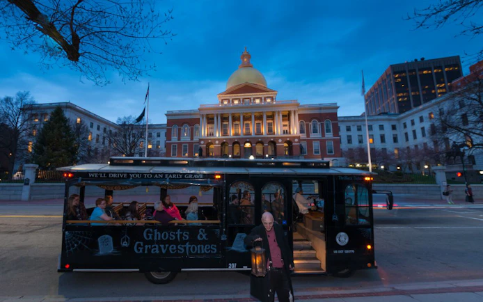 Ghost tour trolley in front of historic building, St. Augustine Ghosts & Gravestones.