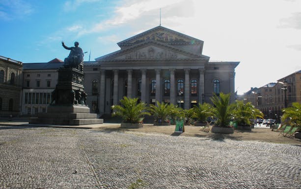 Munich's National Theatre with Max-Joseph statue in the foreground during an evening walk.