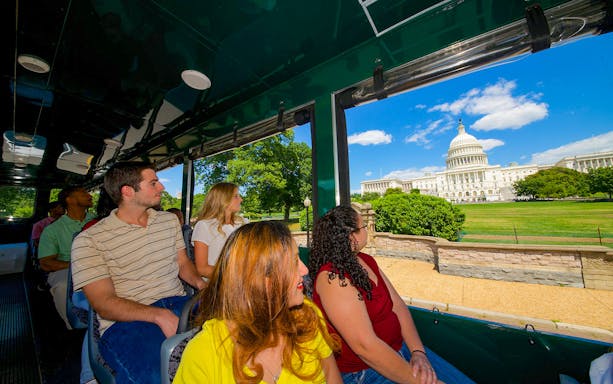 Tourists on Washington DC Old Town Trolley viewing the US Capitol building.