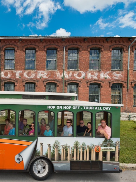 Nashville hop-on hop-off trolley in front of Marathon Motor Works building.