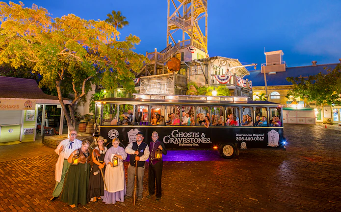 Ghost tour trolley with costumed guides in front of historic building, Boston Ghosts & Gravestones.