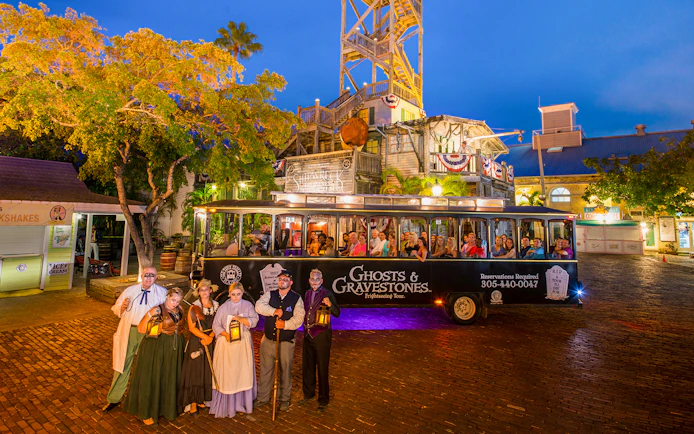Ghost tour trolley with costumed guides in front of historic building, Boston Ghosts & Gravestones.