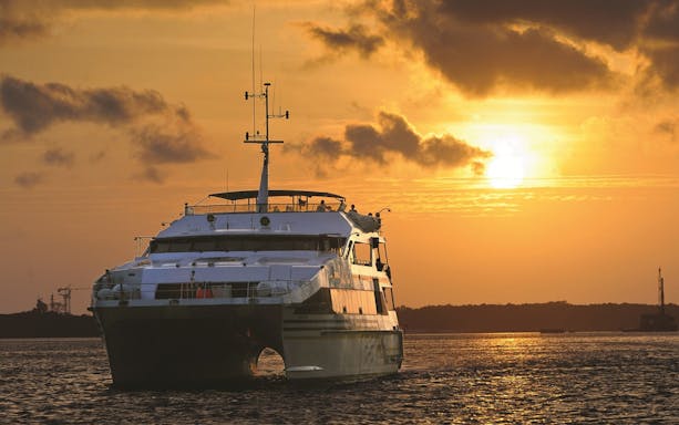 Catamaran sailing during a Bali sunset cruise.