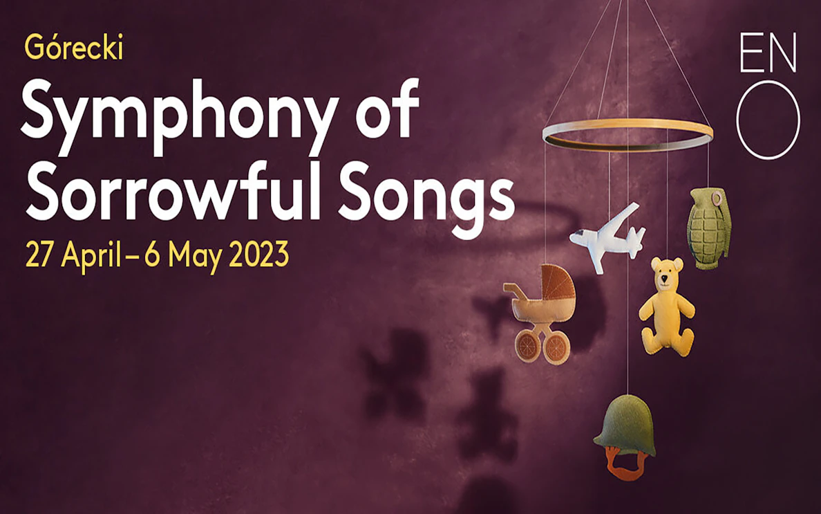 Górecki's Symphony of Sorrowful Songs poster with mobile of toys and military items.