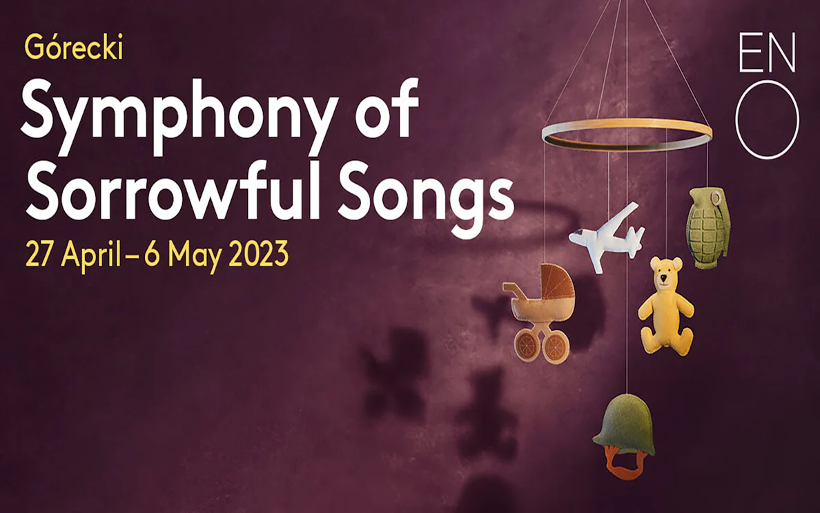 Górecki's Symphony of Sorrowful Songs poster with mobile of toys and military items.