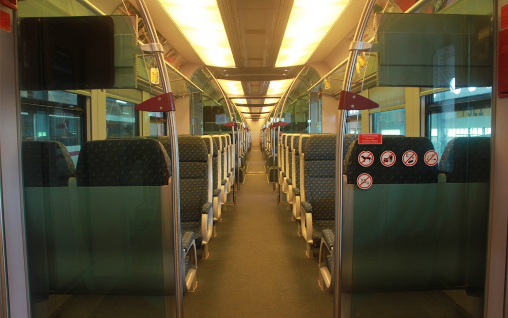 Interior of KLIA Ekspress train with empty seats, part of KL Tower Observation Deck combo.