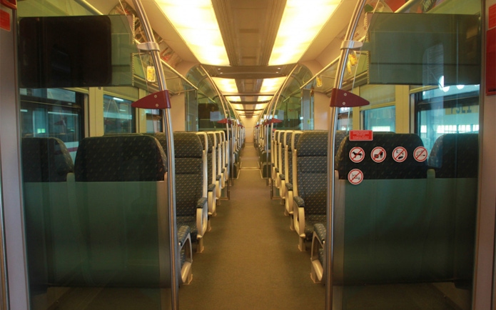 Interior of KLIA Ekspress train with empty seats, part of KL Tower Observation Deck combo.
