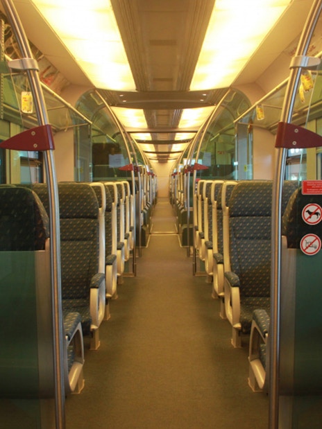Interior of KLIA Ekspress train with empty seats, part of KL Tower Observation Deck combo.